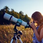 depositphotos_322379740-stock-photo-little-girl-using-telescope-in